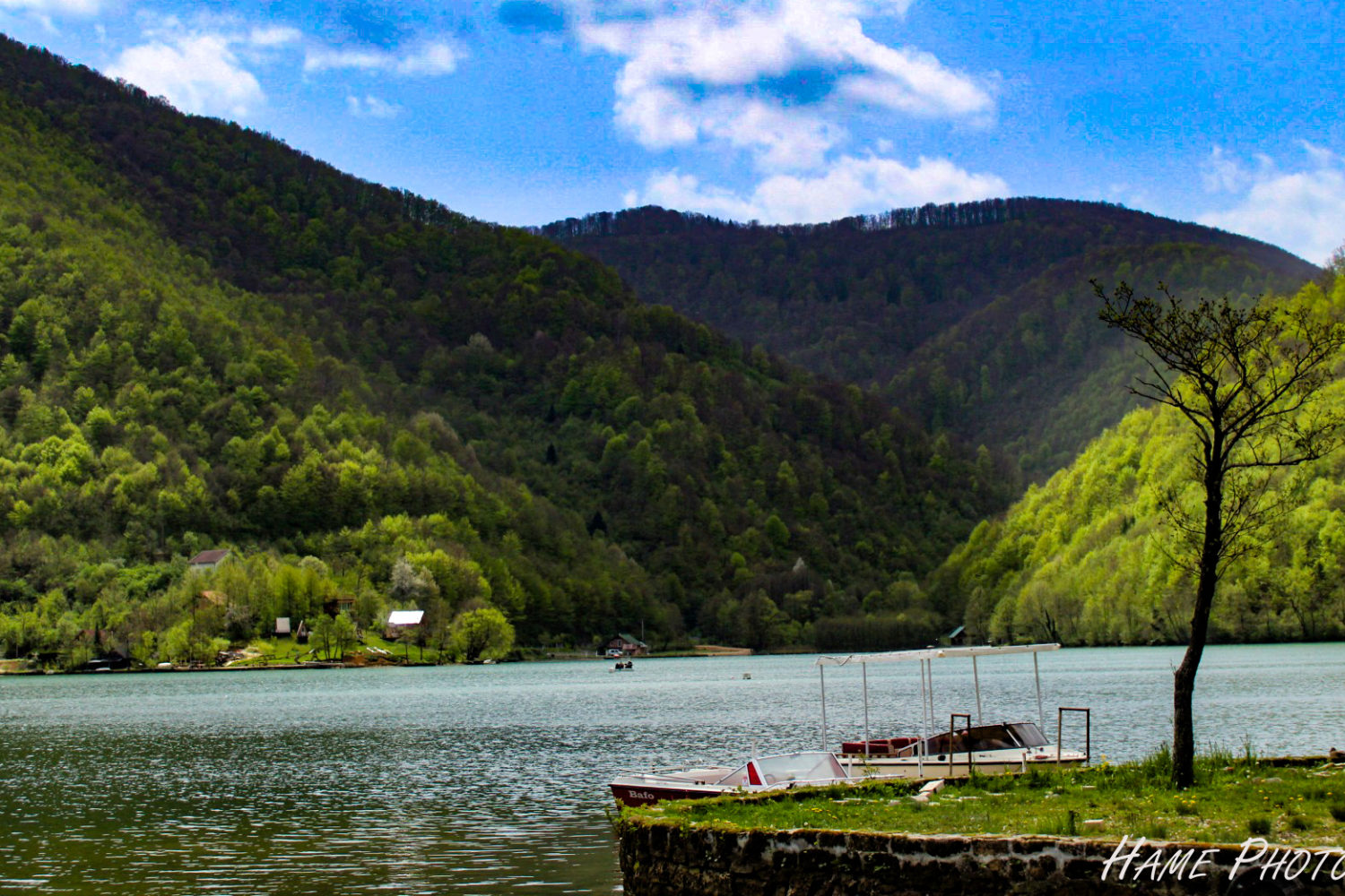 Veliko Plivsko Lake surrounded by lush green hills in Bosnia and Herzegovina