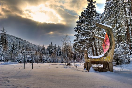 Snow-covered landscape with a unique sundial sculpture near Napretkov Dom, Sarajevo.
