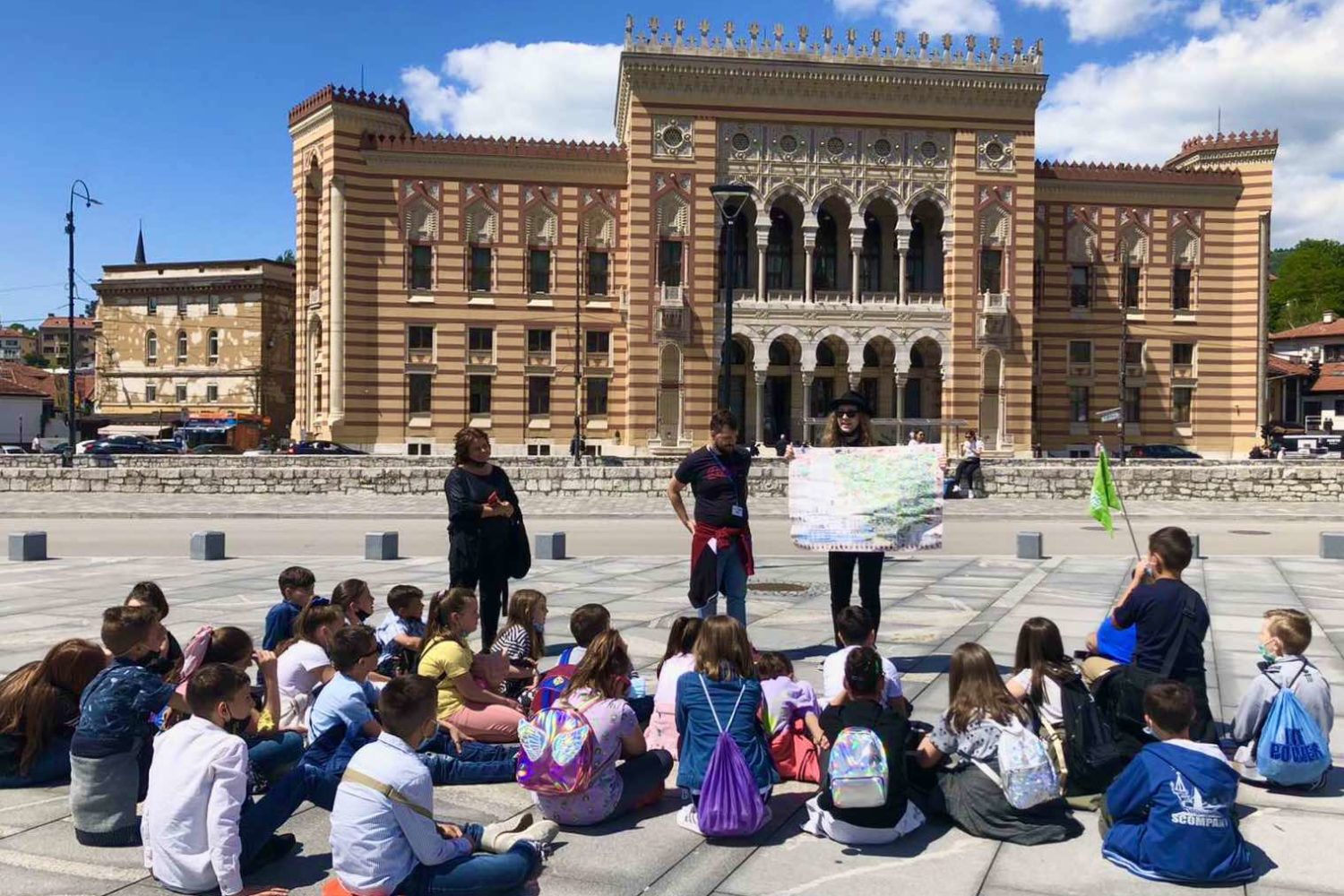 Group of children attending an educational session in front of Sarajevo City Hall
